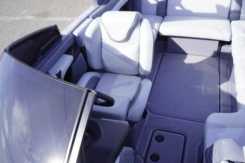 Slide: The Image of 2023 Malibu M220 boat interior with sleek seating and modern design. - 48