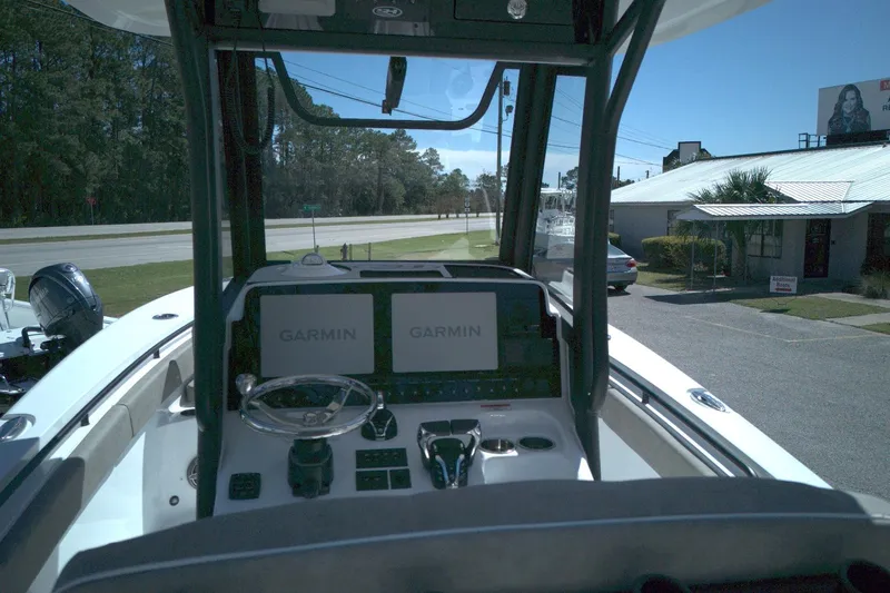 Slide: The Image of Interior view of 2026 Sea Hunt Gamefish 25 boat with Garmin navigation displays. - 10