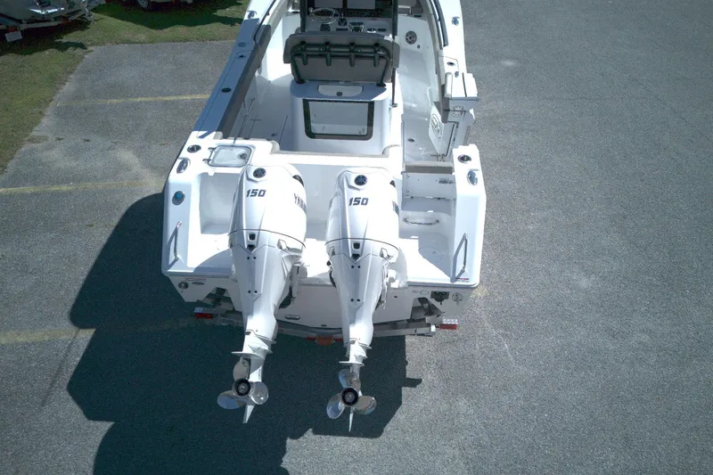 Slide: The Image of 2026 Sea Hunt Gamefish 25 boat with dual Yamaha 150 engines, aerial view. - 12