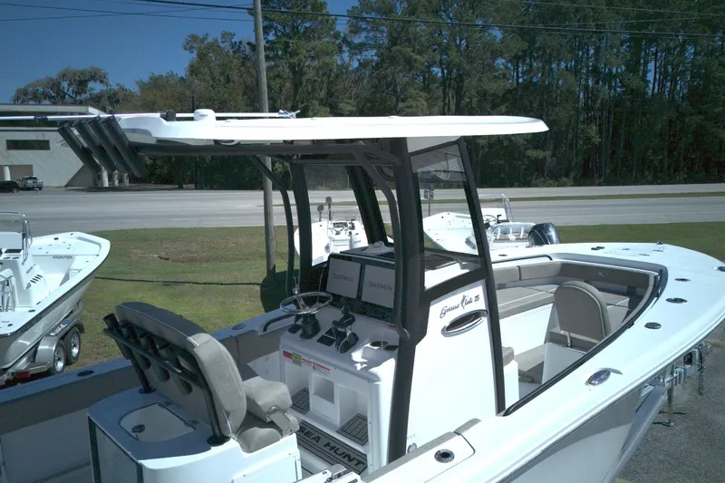Slide: The Image of 2026 Sea Hunt Gamefish 25 boat with modern console and seating. - 8