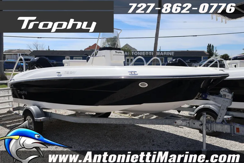 The Image of 2026 Bayliner Trophy T18 boat on trailer at Antonietti Marine dealership. - 1