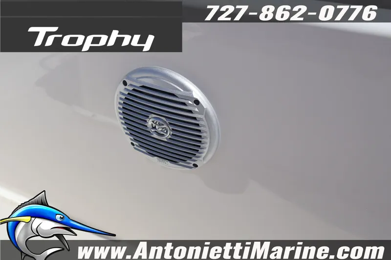 Slide: The Image of 2026 Bayliner Trophy T18 boat speaker detail with logo and contact information. - 12