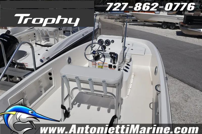 Slide: The Image of 2026 Bayliner Trophy T18 boat interior with steering console, showcased at Antonietti Marine. - 6