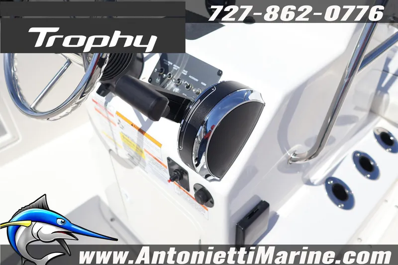Slide: The Image of 2026 Bayliner Trophy T18 boat dashboard with steering wheel and controls, Antonietti Marine branding. - 9