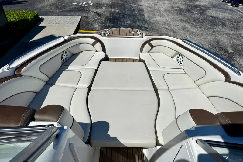Slide: The Image of 2013 Yamaha Boats 242 Limited S interior with spacious seating and sleek design. - 10