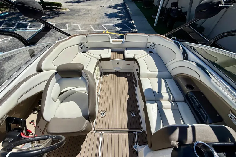 Slide: The Image of 2013 Yamaha Boats 242 Limited S interior with spacious seating and sleek design. - 13