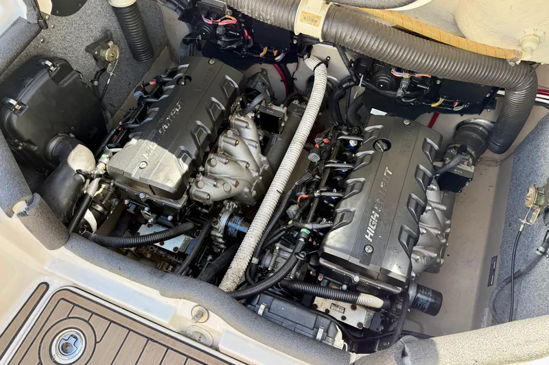 Slide: The Image of Engine compartment of a 2013 Yamaha Boats 242 Limited S, showcasing dual engines. - 14