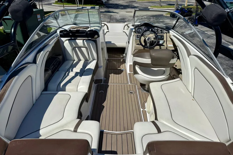 Slide: The Image of 2013 Yamaha Boats 242 Limited S interior with spacious seating and modern dashboard. - 8