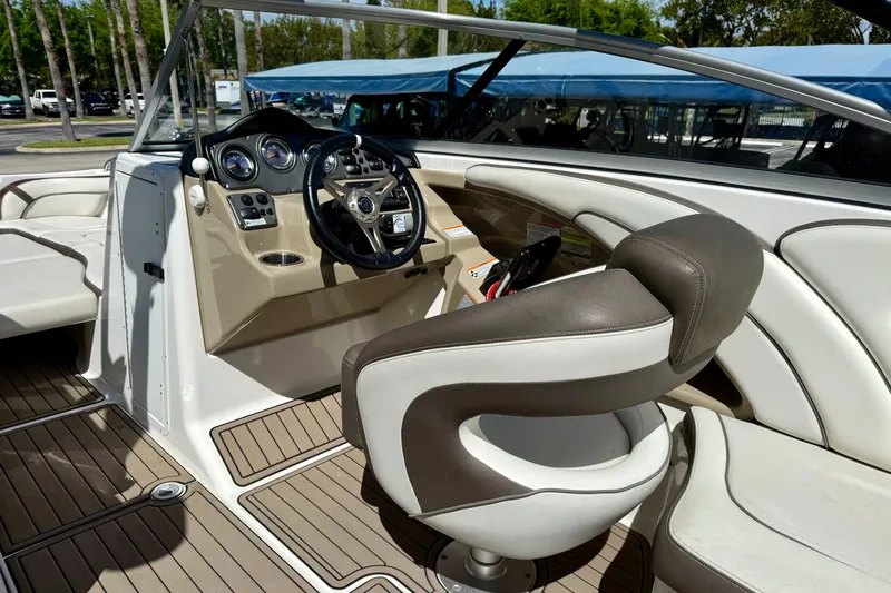 Slide: The Image of Interior view of 2013 Yamaha Boats 242 Limited S, featuring steering wheel and seating. - 9