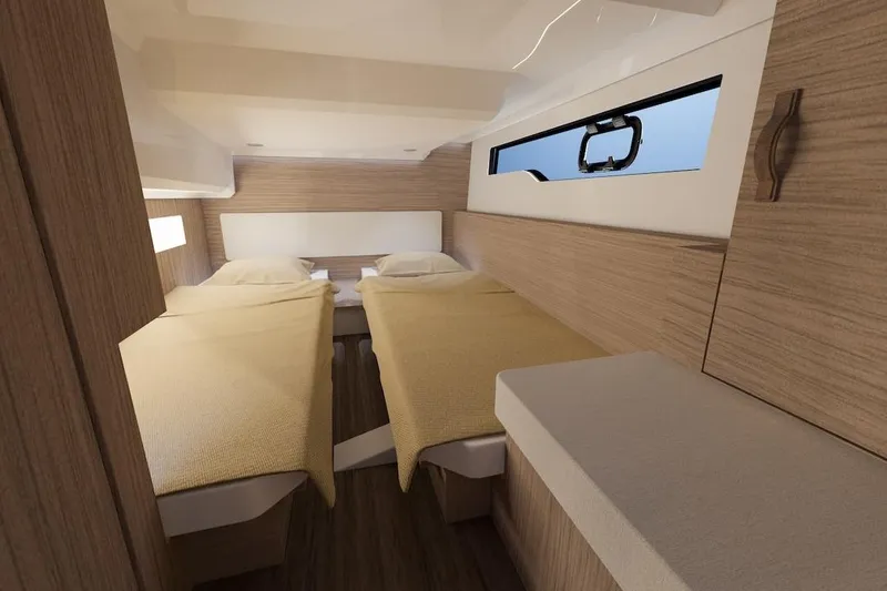 Slide: The Image of Interior cabin of 2026 Jeanneau NC 1095 Fly Series 2 with twin beds and modern design. - 9