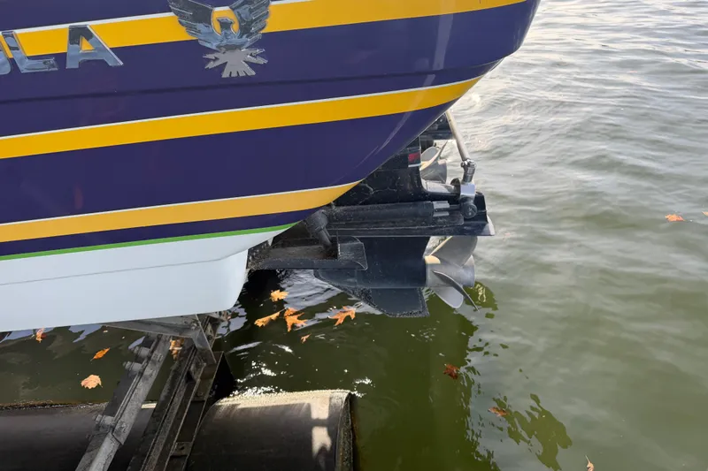 Slide: The Image of Rear view of a 2001 Formula 312 FASTech boat with dual propellers in water. - 13