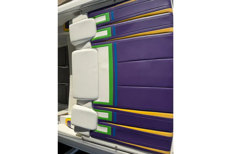 Slide: The Image of Purple and yellow seating of a 2001 Formula 312 FASTech boat. - 18