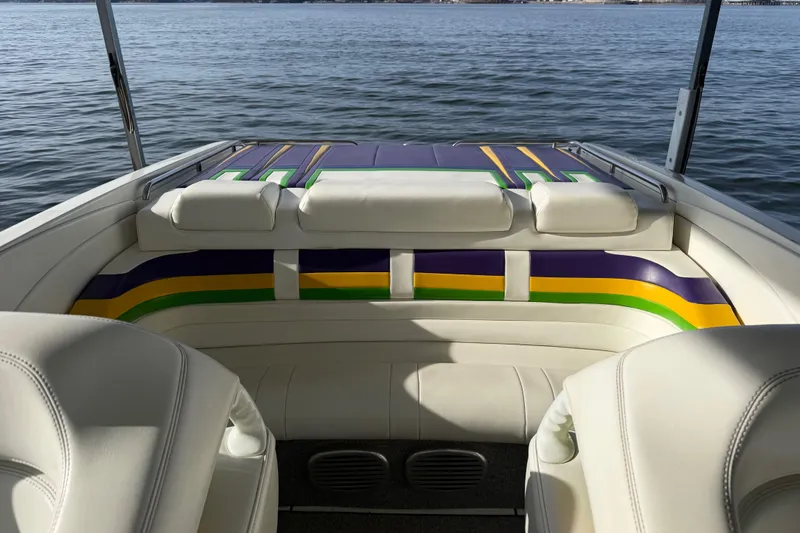 Slide: The Image of 2001 Formula 312 FASTech boat interior with colorful upholstery on a calm lake. - 20