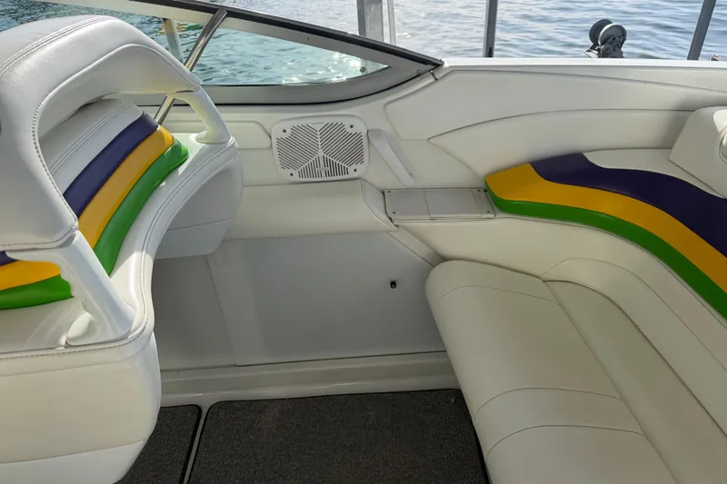 Slide: The Image of Interior of 2001 Formula 312 FASTech boat with colorful seating and speaker. - 21
