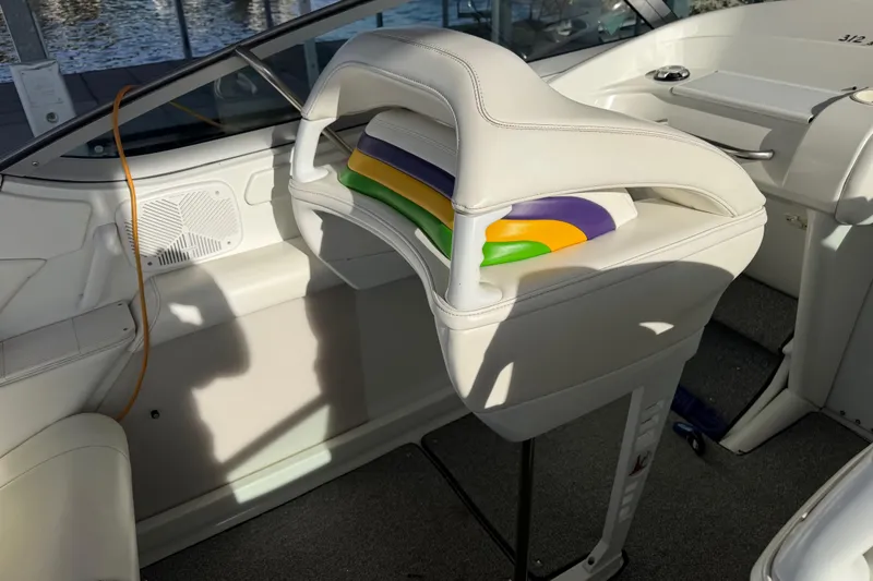 Slide: The Image of Interior of a 2001 Formula 312 FASTech boat with white seating and colorful accents. - 22