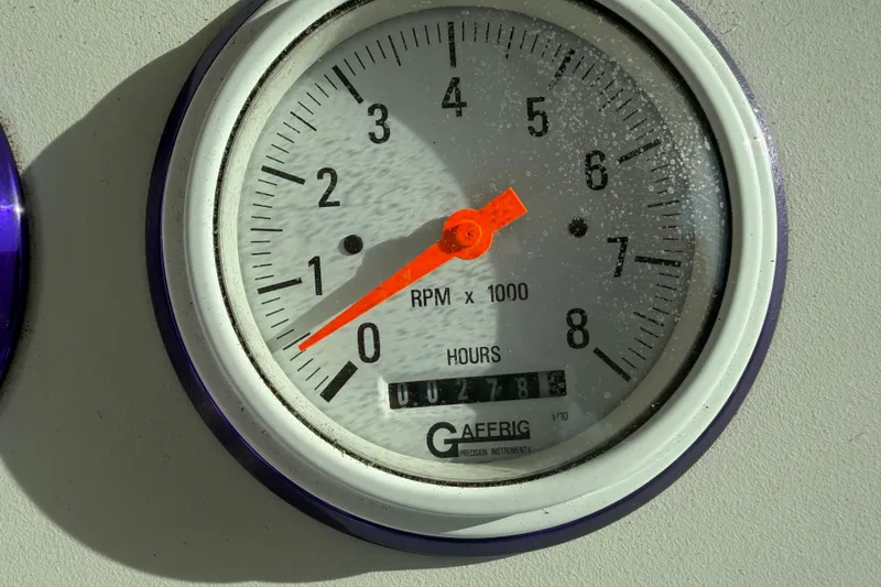 Slide: The Image of Tachometer of 2001 Formula 312 FASTech showing RPM and hours. - 27