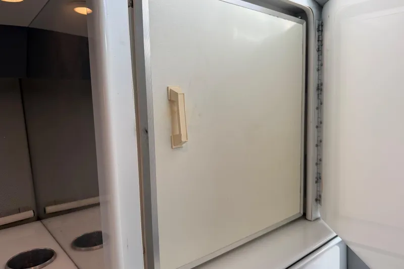 Slide: The Image of Interior of a 2001 Formula 312 FASTech boat showing a storage compartment. - 30