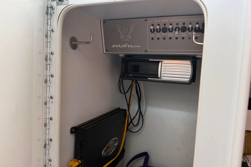 Slide: The Image of Control panel inside a 2001 Formula 312 FASTech boat compartment. - 31