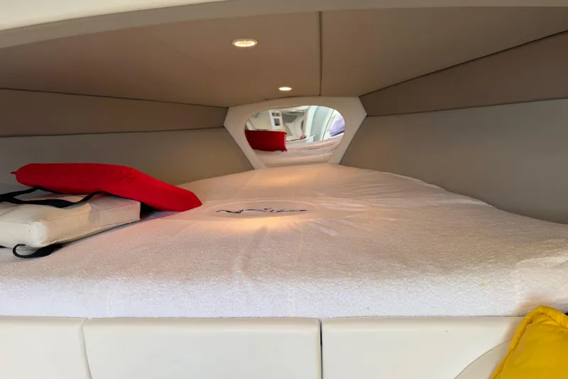 Slide: The Image of Interior cabin of a 2001 Formula 312 FASTech boat with cozy bedding and cushions. - 36