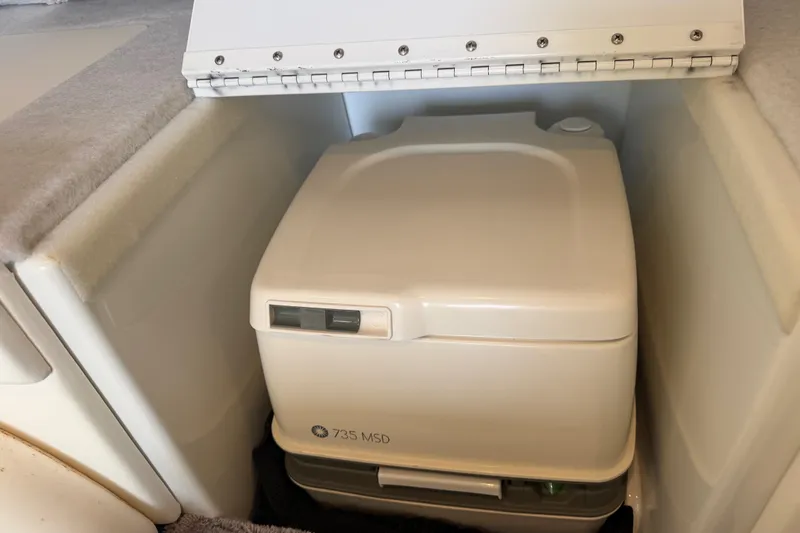 Slide: The Image of Portable toilet in a 2001 Formula 312 FASTech boat cabin. - 37