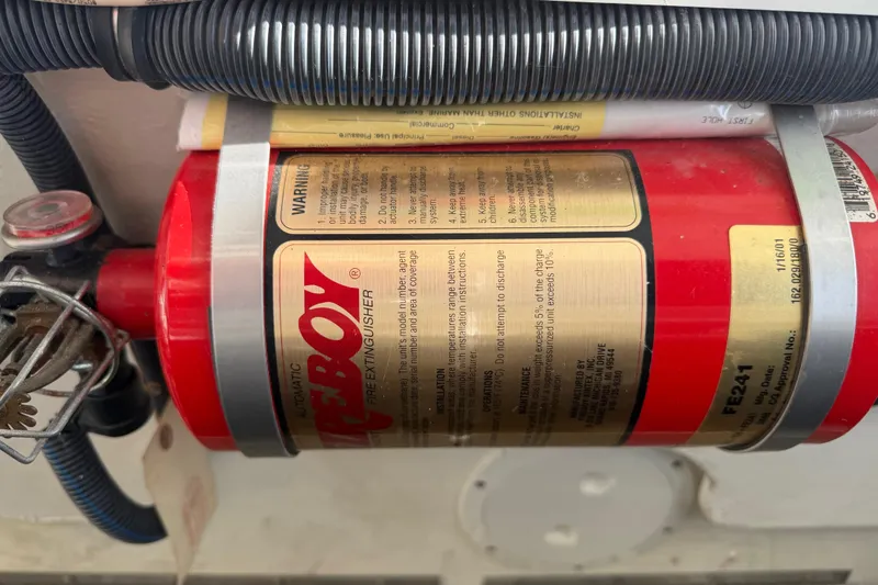 Slide: The Image of Red fire extinguisher mounted on a 2001 Formula 312 FASTech boat. - 42