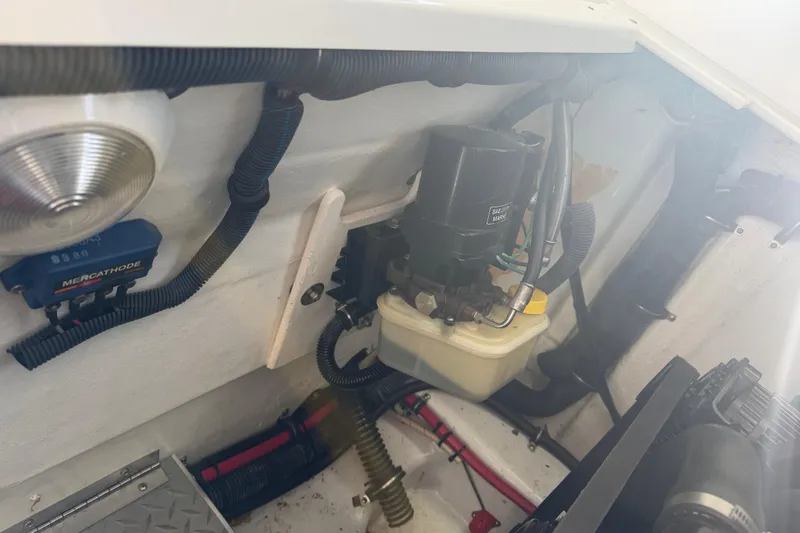 Slide: The Image of Engine compartment of a 2001 Formula 312 FASTech boat, showing mechanical components and wiring. - 43