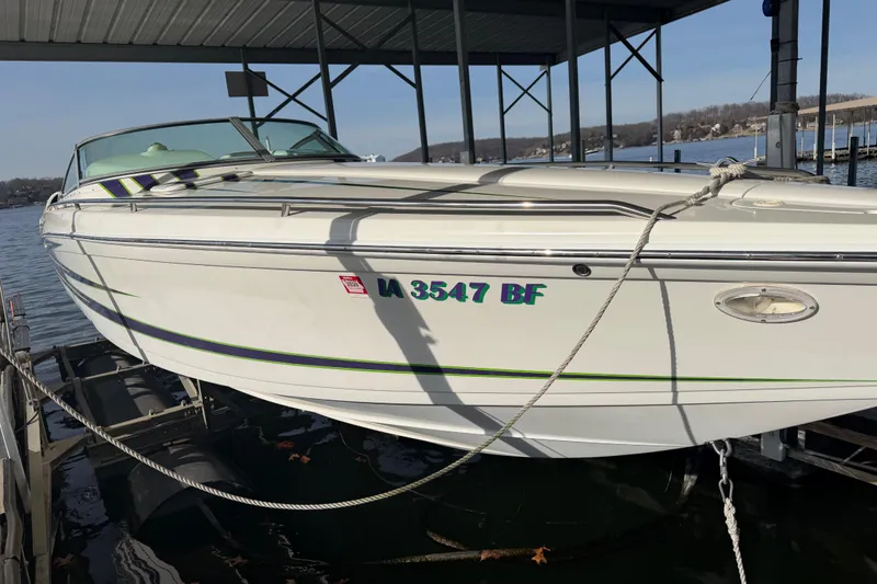 Slide: The Image of 2001 Formula 312 FASTech boat docked at a marina, side view. - 7