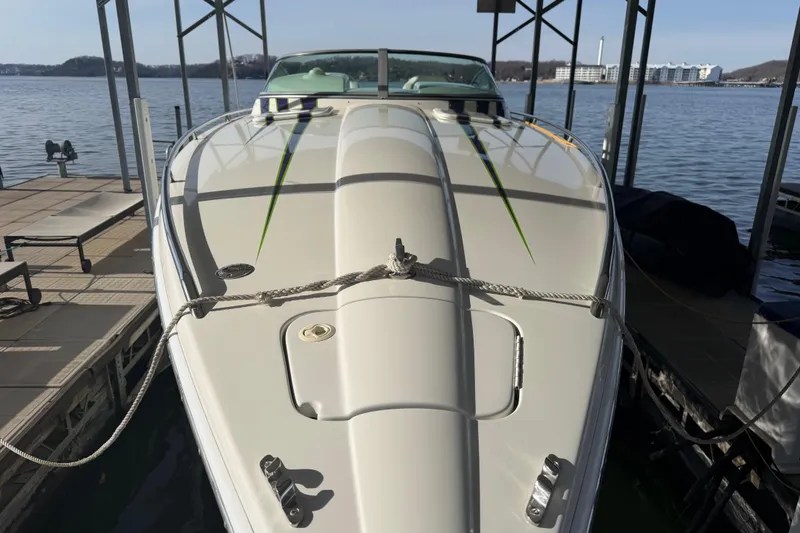 Slide: The Image of 2001 Formula 312 FASTech boat docked on a sunny day by the lake. - 9