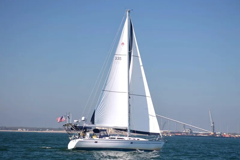 Slide: The Image of Sailing yacht Catalina 400 MkII 2006 on open water with clear blue sky. - 1