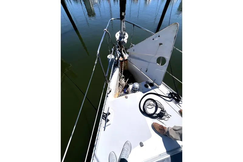 Slide: The Image of Deck view of a 2006 Catalina 400 MkII sailboat with anchor and ropes. - 11