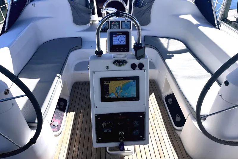 Slide: The Image of Cockpit of 2006 Catalina 400 MkII sailboat with navigation equipment and seating. - 12