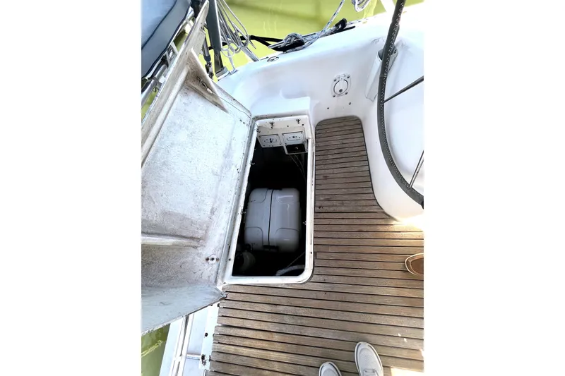 Slide: The Image of Open hatch on 2006 Catalina 400 MkII sailboat, revealing engine compartment and wooden deck. - 14