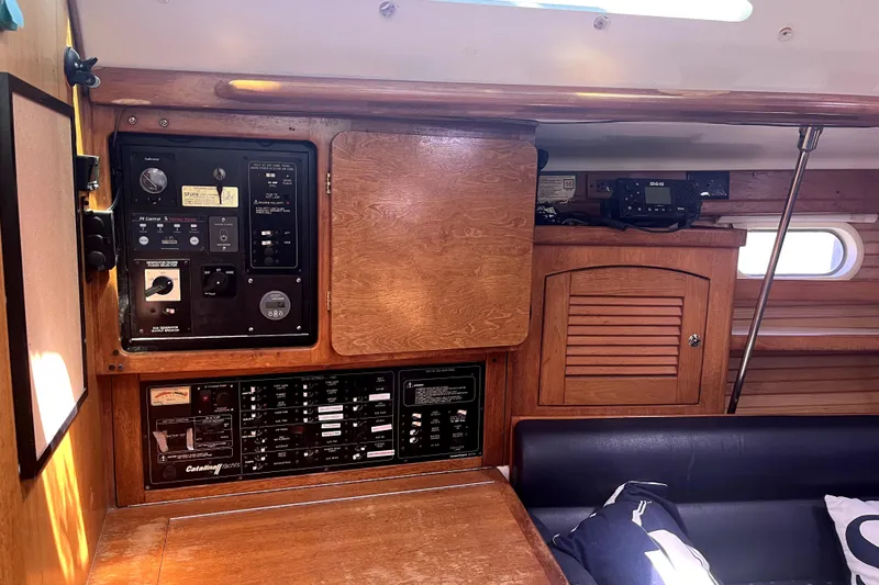 Slide: The Image of Interior of a 2006 Catalina 400 MkII sailboat with control panels and wooden cabinetry. - 17