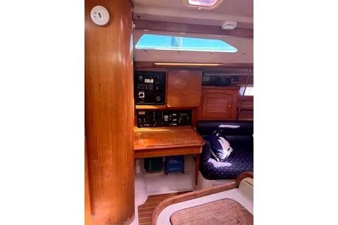 Slide: The Image of Interior of 2006 Catalina 400 MkII sailboat with wooden cabinetry and navigation station. - 18