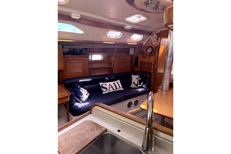 Slide: The Image of Interior of 2006 Catalina 400 MkII sailboat with cozy seating and nautical decor. - 20