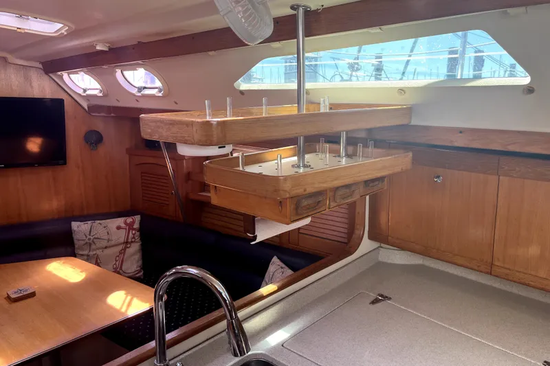 Slide: The Image of Interior of 2006 Catalina 400 MkII sailboat with wooden cabinetry and seating area. - 30