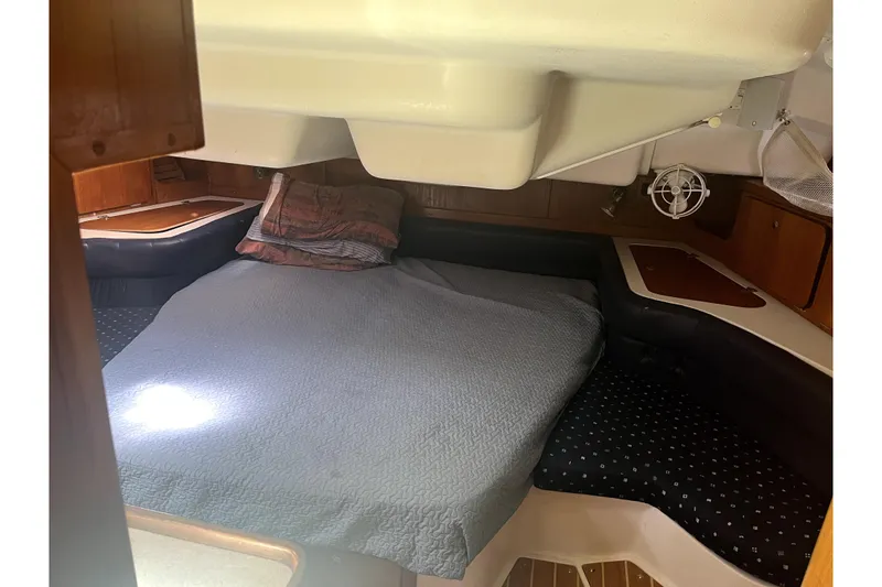Slide: The Image of Cozy cabin interior of 2006 Catalina 400 MkII sailboat with bed and wooden accents. - 32
