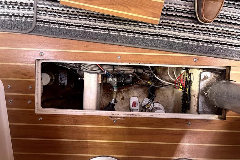 Slide: The Image of Open hatch revealing wiring and components inside a 2006 Catalina 400 MkII sailboat. - 43