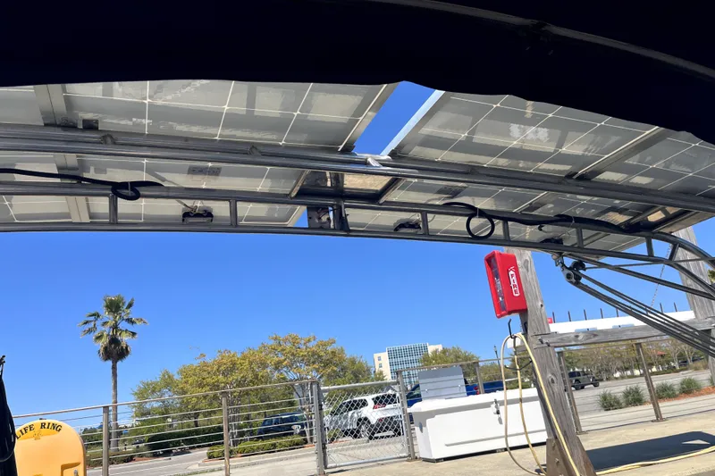 Slide: The Image of Solar panels on a Catalina 400 MkII yacht, docked with clear blue sky background. - 9
