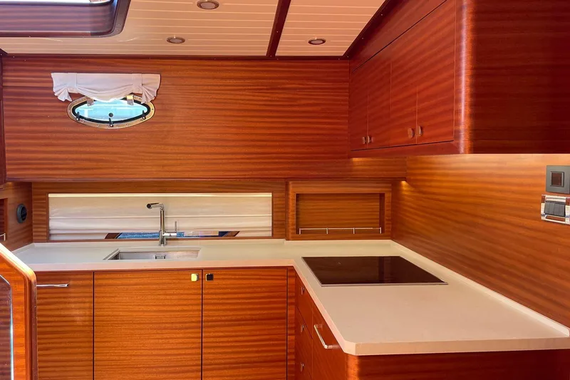 Slide: The Image of Luxurious wooden kitchen interior of 2027 Vicem 62 Flybridge yacht with modern amenities. - 14