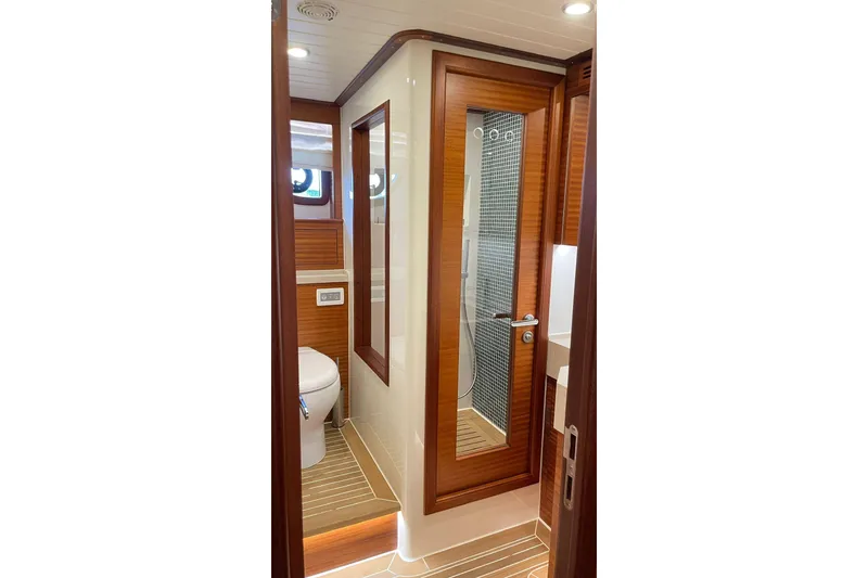 Slide: The Image of Luxurious bathroom interior of 2027 Vicem 62 Flybridge yacht with wood accents and modern fixtures. - 18