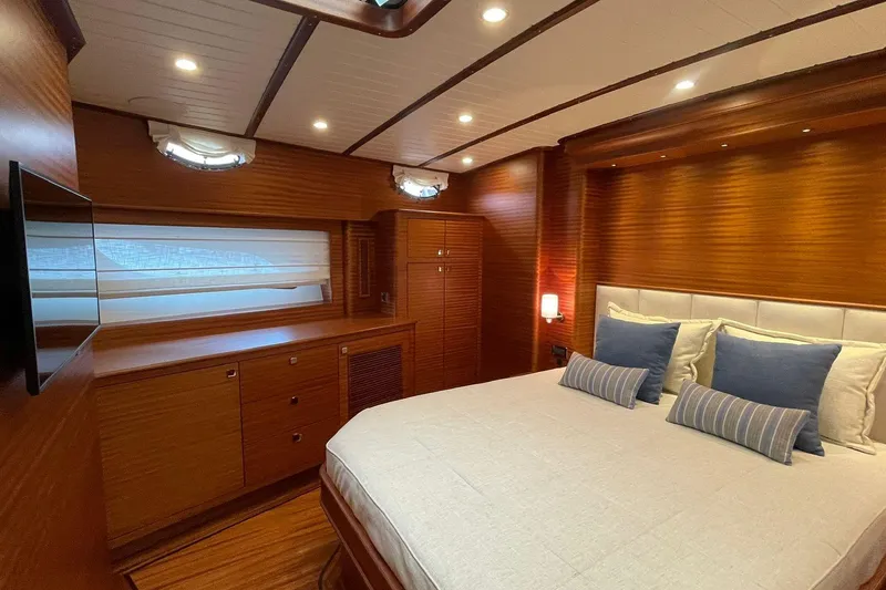 Slide: The Image of Luxurious cabin interior of 2027 Vicem 62 Flybridge yacht with elegant wood finish. - 19