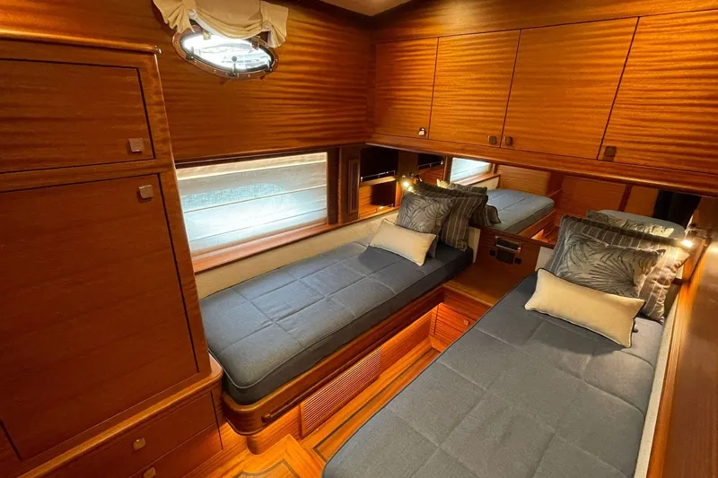 Slide: The Image of Luxurious twin cabin interior of 2027 Vicem 62 Flybridge yacht with wooden finishes. - 20