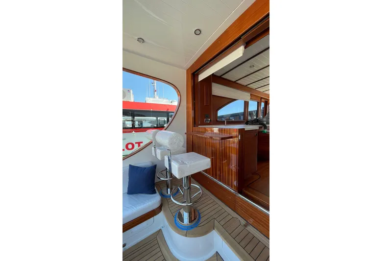Slide: The Image of Luxurious interior of 2027 Vicem 62 Flybridge yacht with elegant wood finishes. - 5
