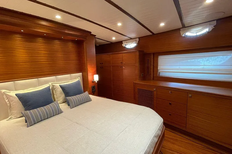 Slide: The Image of Luxurious bedroom interior of 2027 Vicem 62 Flybridge yacht with wooden finishes. - 9
