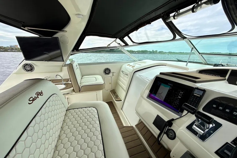 Slide: The Image of Luxurious 1995 Sea Ray Sundancer 370 yacht interior with modern dashboard and comfortable seating. - 12