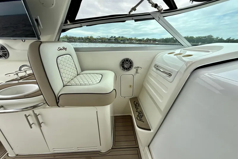 Slide: The Image of Interior of a 1995 Sea Ray Sundancer 370 boat with seating and sink. - 14