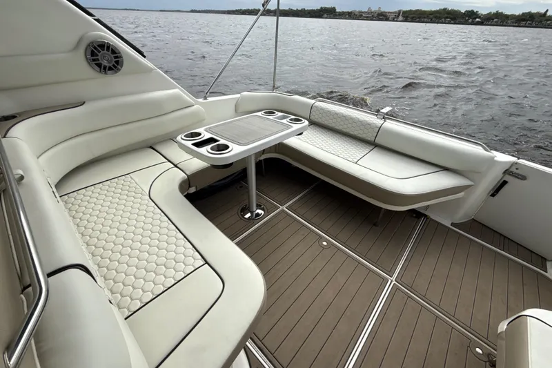 Slide: The Image of Luxurious seating area on a 1995 Sea Ray Sundancer 370 yacht with scenic water view. - 18