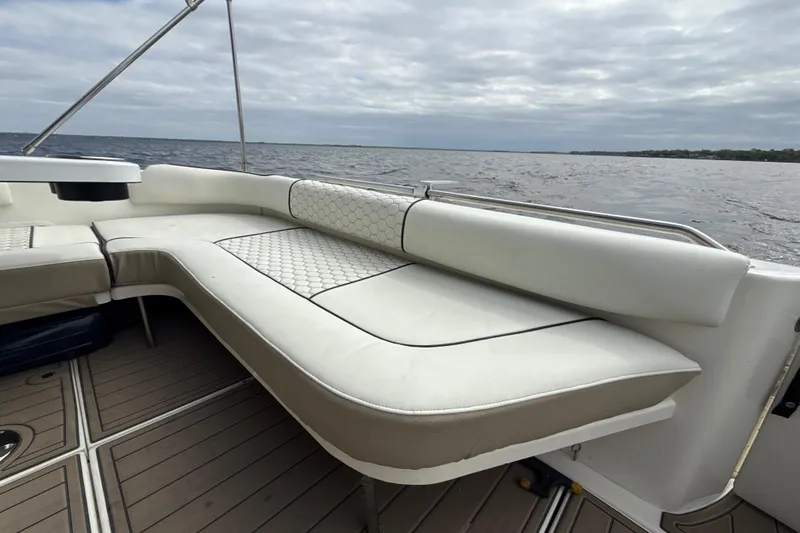 Slide: The Image of Luxurious seating on a 1995 Sea Ray Sundancer 370 yacht, overlooking serene waters. - 21