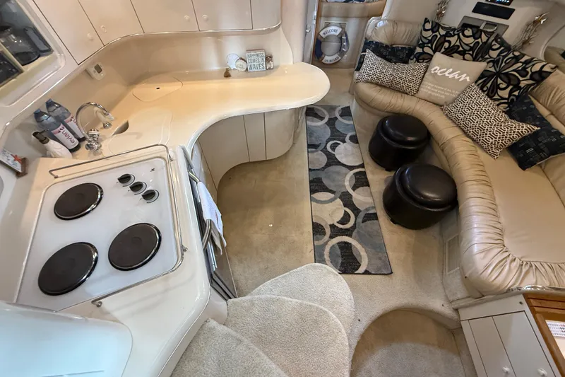 Slide: The Image of Interior of 1995 Sea Ray Sundancer 370 yacht with kitchen and seating area. - 22